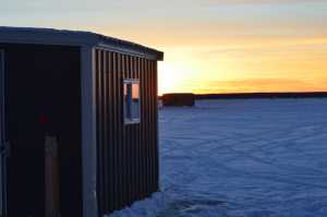 cyrus-fish-house-with-sunset, planning ice fishing