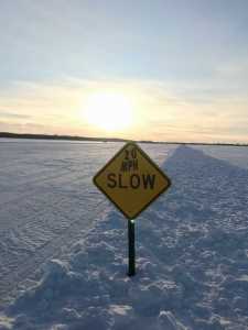 Ice road slow sign, Zippel Bay Resort, Lake of the Woods