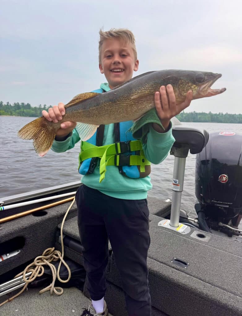 Boy with nice walleye, Oak Island Lodge, NW Angle, Lake of the Woods