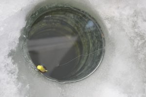 Bobber in fish hole, Lake of the Woods