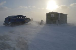 Bombardier, fish house, blowing snow