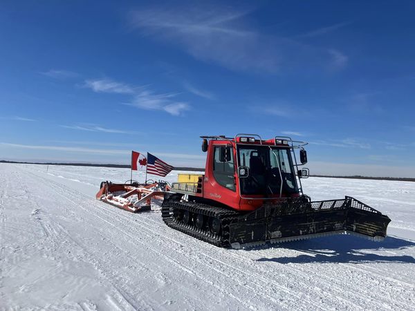 Groomer keeping snowmobile trails groomed and in good shape on Lake of the Woods