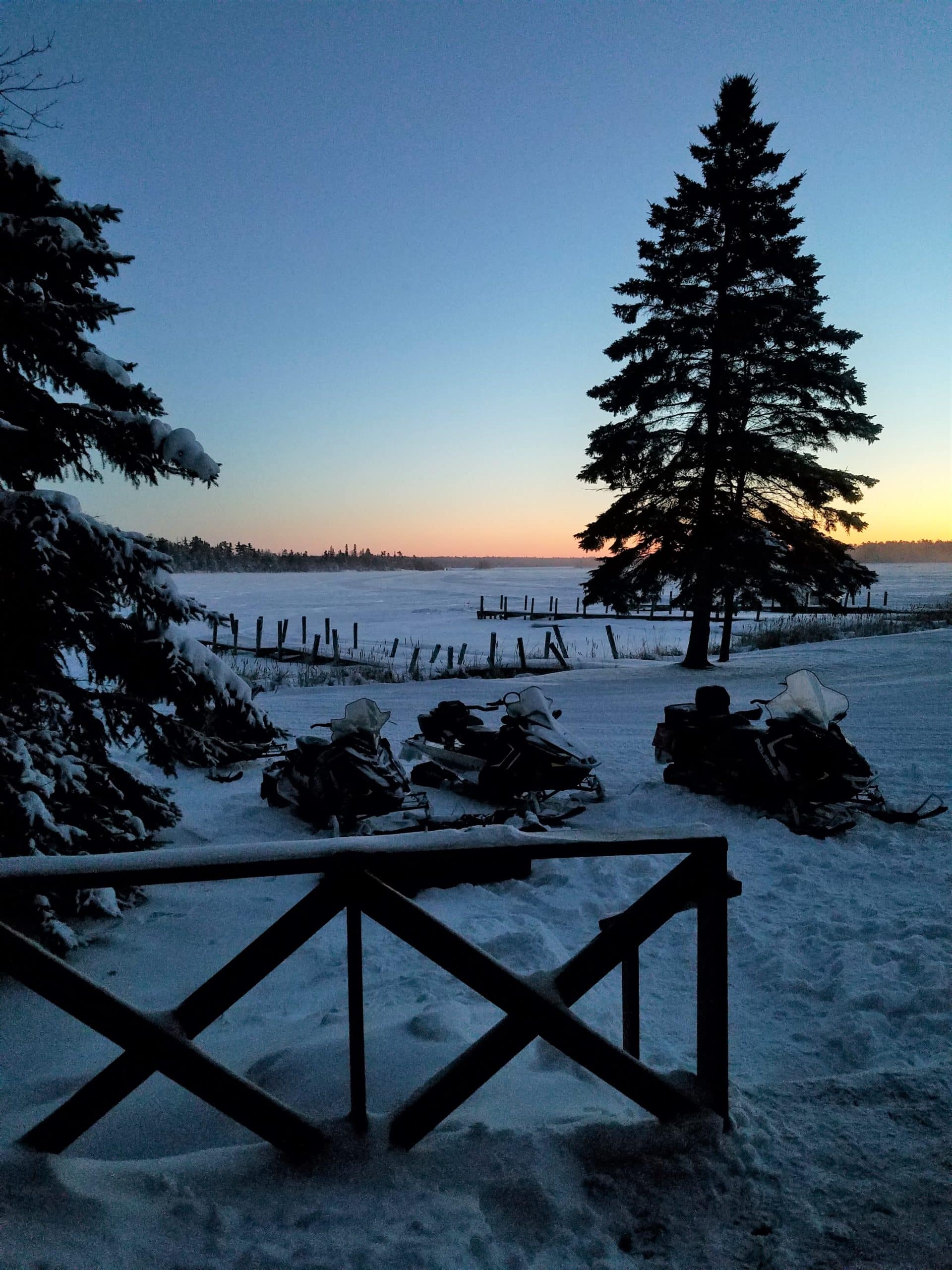snowmobiles parked at a NW Angle resort on Lake of the Woods. Snowmobiling