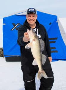 Joe Henry, walleye and clam flip over collapsible fish house