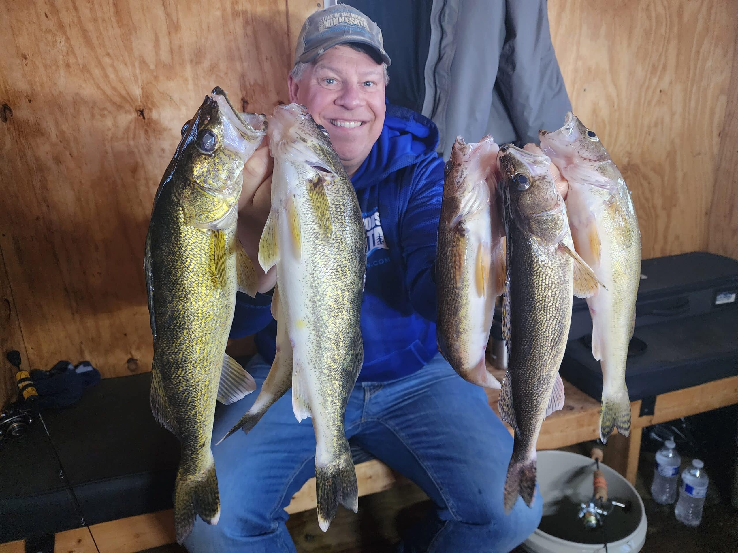 Joe Henry in a Lake of the Woods fish house with a limit of walleyes and saugers