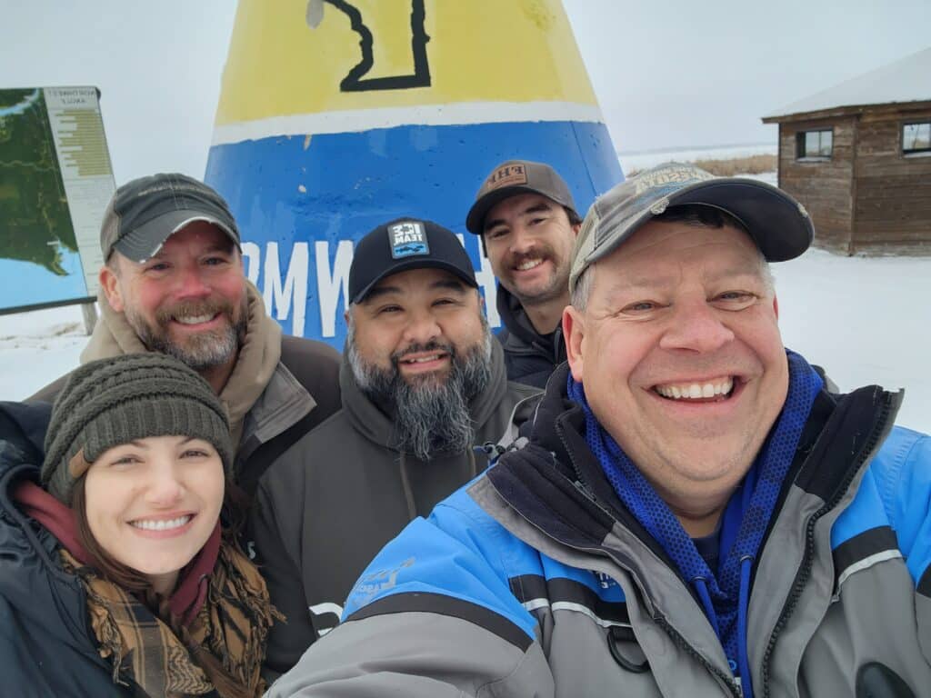 Group photo, having fun at the NW Angle, northernmost point buoy