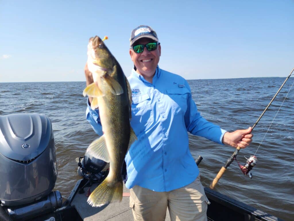 Joe Henry, Lake of the Woods Tourism with a summer walleye