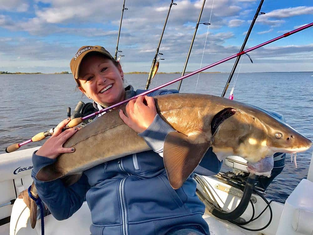 Kristin Monroe with a big sturgeon caught on a St. Croix rod at the 2017 AGLOW Conference at Lake of the Woods MN