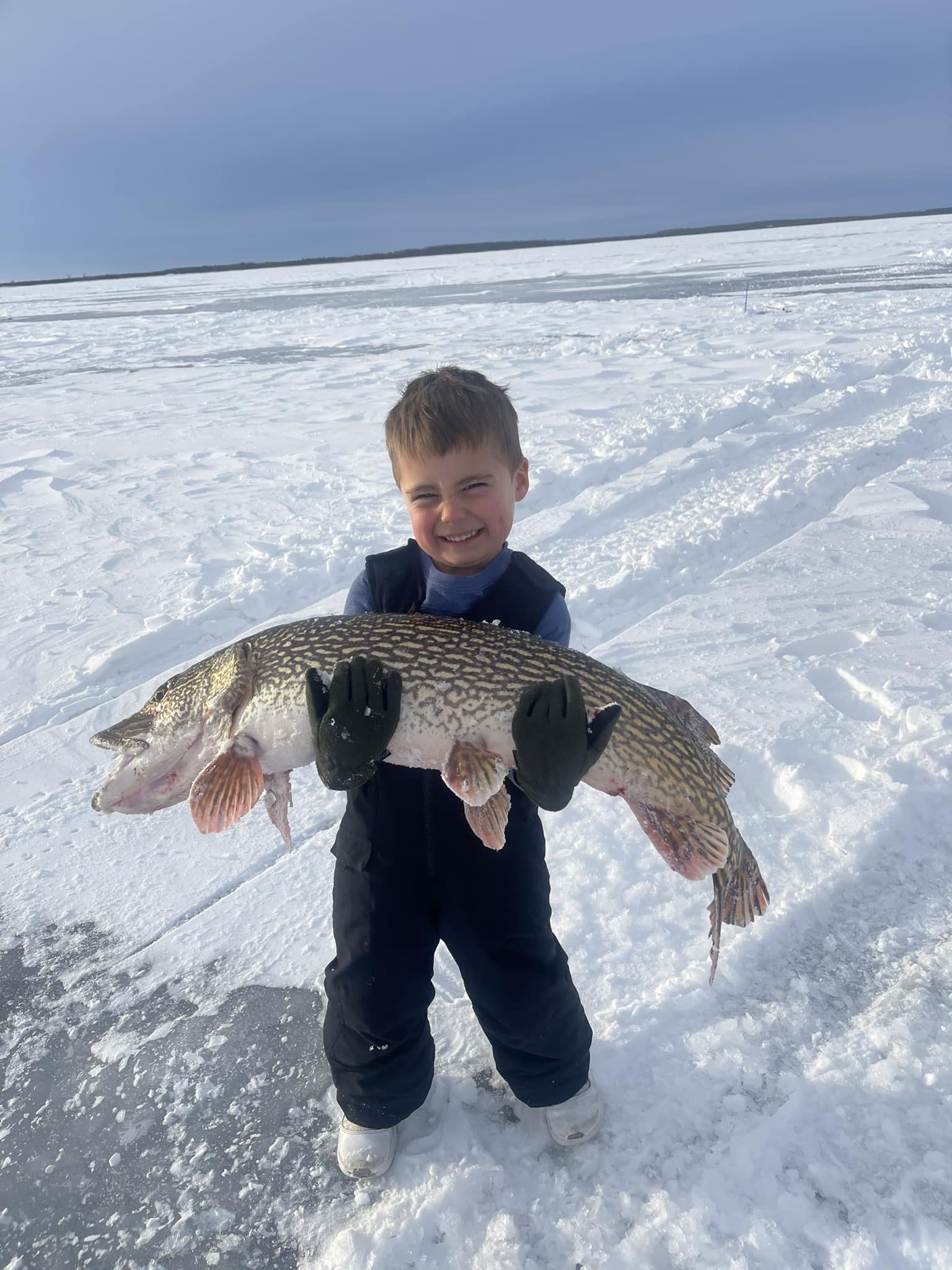 This big Pike caught is bigger than this boy What a great fishing report.
