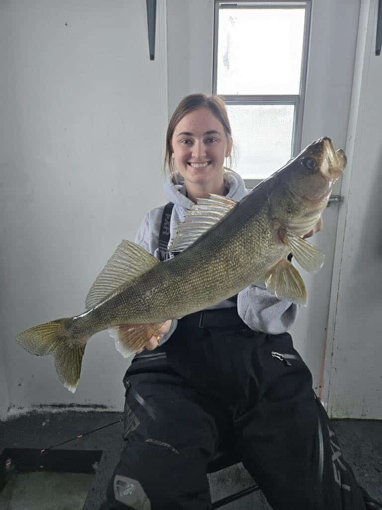 Macey with 27 inch walleye caught at Lake of the Woods MN while ice fishing