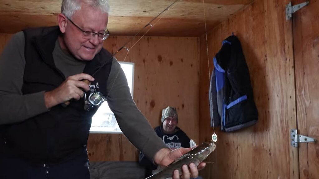 John Bergsma and Greg Jones in fish house on Lake of the Woods MN