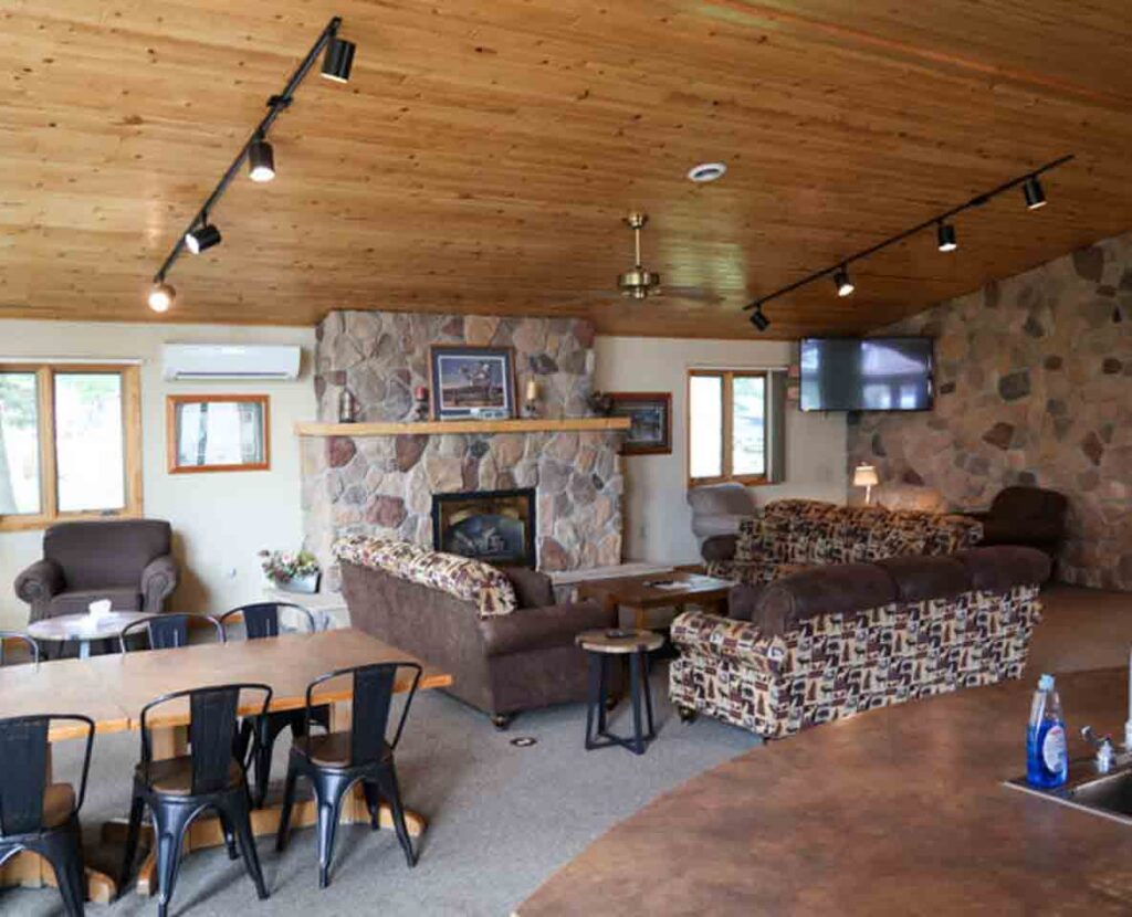 A luxurious cabin on Lake of the Woods with a huge great room and a stone fireplace