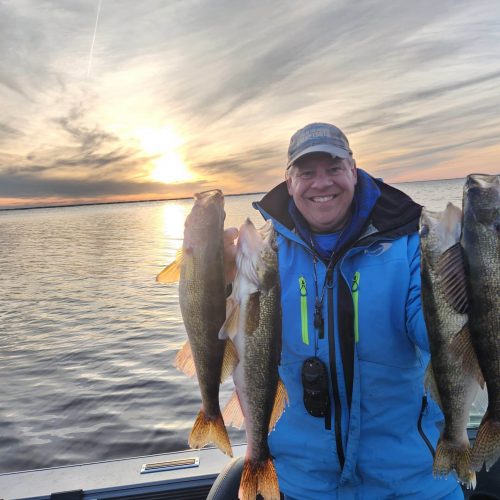 Joe Henry with a limit of walleyes on Lake of the Woods at sunset