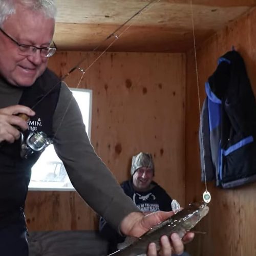 John Bergsma and Greg Jones in fish house on Lake of the Woods MN