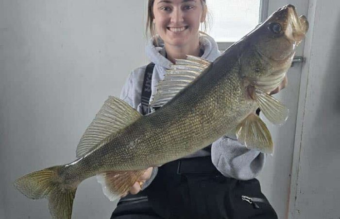 Macey with 27 inch walleye caught at Lake of the Woods MN while ice fishing