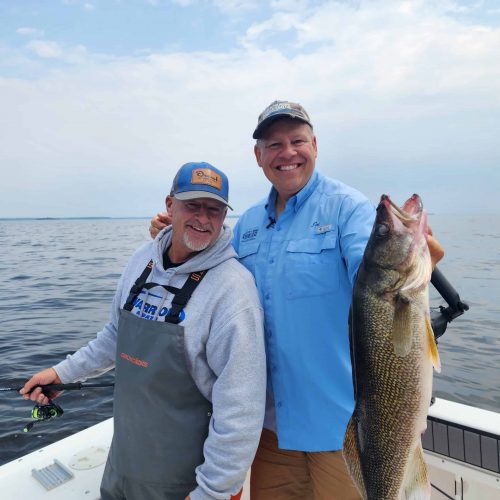 Larry Smith and Joe Henry, big walleye on charter boat, Lake of the Woods